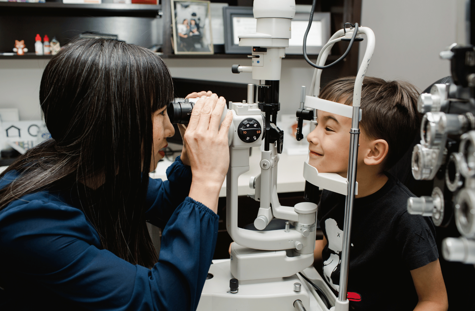 Dr. Melina Chow examines a boy's eyes at Henderson Vision Centre