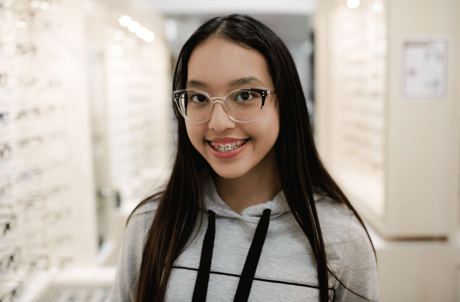 A young girl wearing a pair of glasses to control myopia progression.