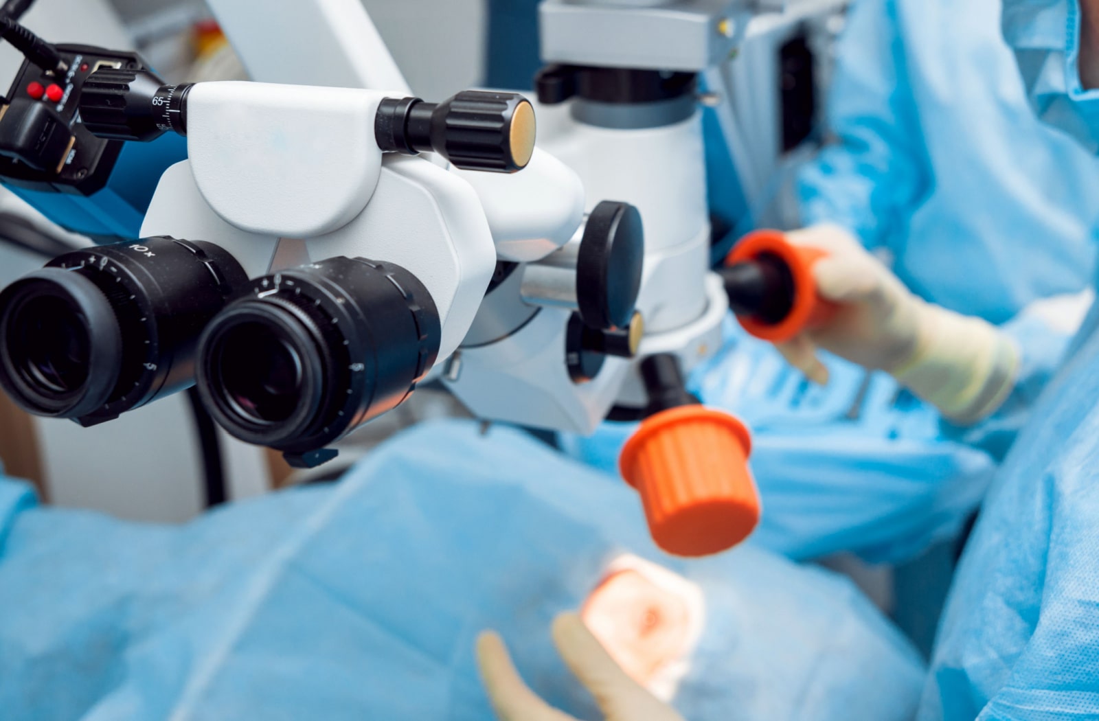 A surgeon preparing for cataract surgery on a patient