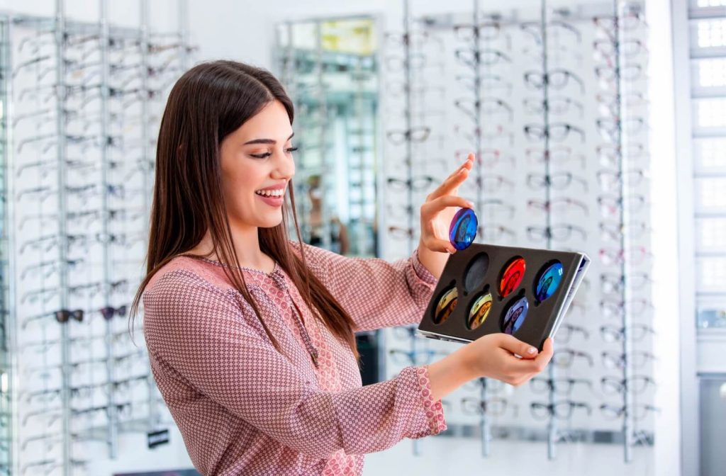 An eye doctor showing different polarized lens options.