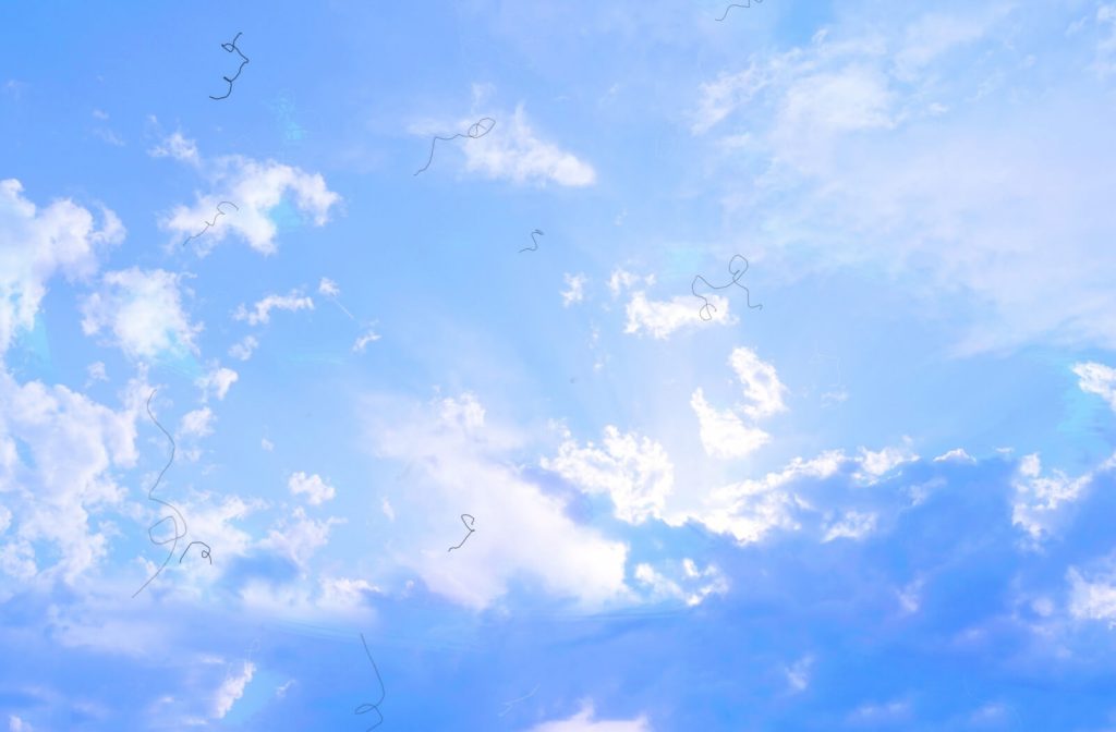 An image of the sky from the point of view of someone with floaters in their vision.